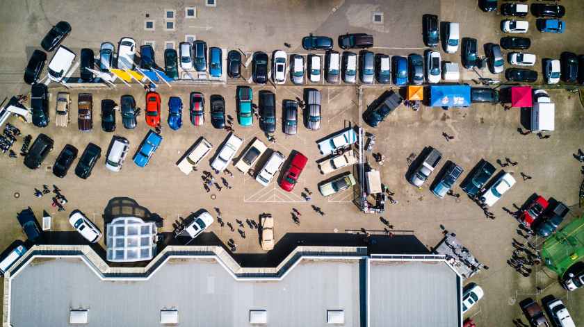 photo from above of vehicles parked near building